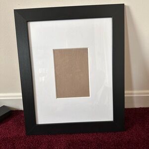 Black picture frame with matte and backing
